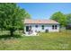 Back of home with patio, fenced yard, central air, and sliding glass door at 3121 Suffolk Dr, Shelby, NC 28152