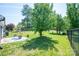 Spacious fenced backyard featuring a patio seating area and mature trees for privacy at 3121 Suffolk Dr, Shelby, NC 28152