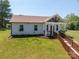 Charming home featuring a welcoming front porch with wooden accents and a well-manicured lawn at 3121 Suffolk Dr, Shelby, NC 28152