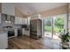 Bright kitchen features granite countertops, stainless steel appliances, and backyard patio access at 3121 Suffolk Dr, Shelby, NC 28152