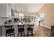 Bright kitchen features granite countertops, stainless steel appliances, and a breakfast bar with seating at 3121 Suffolk Dr, Shelby, NC 28152
