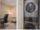 Convenient laundry area featuring a modern, stacked washer and dryer unit at 3121 Suffolk Dr, Shelby, NC 28152