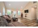Bright living room featuring vaulted ceilings, hardwood floors, and abundant natural light at 3121 Suffolk Dr, Shelby, NC 28152