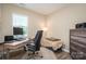 The home office has a computer desk, comfortable chair, decor, and wooden floors at 3121 Suffolk Dr, Shelby, NC 28152