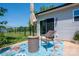 Relaxing outdoor patio with a blue patterned rug, table and chair, and a sliding glass door at 3121 Suffolk Dr, Shelby, NC 28152
