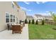 Spacious backyard with a patio area, manicured lawn, and well-maintained landscaping at 3619 Slider Ter, Lancaster, SC 29720