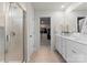 Bright bathroom featuring a tiled glass shower and a double vanity with ample counter space at 3619 Slider Ter, Lancaster, SC 29720