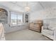 Cozy Bedroom featuring a crib, window seat, and custom shelving for storage and display at 3619 Slider Ter, Lancaster, SC 29720
