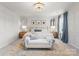 Serene main bedroom with paneled walls, elegant decor, and a large window for natural light at 3619 Slider Ter, Lancaster, SC 29720