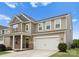 Two-story home featuring a two-car garage and covered porch entry at 3619 Slider Ter, Lancaster, SC 29720