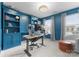 Well-lit home office with built-in shelves, a modern desk, and comfortable seating at 3619 Slider Ter, Lancaster, SC 29720