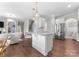 Open concept kitchen with island flows to living spaces. Stainless appliances and ample counter space at 3619 Slider Ter, Lancaster, SC 29720