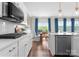 Well-lit kitchen offers stainless steel appliances, white cabinets, and a large window overlooking backyard at 3619 Slider Ter, Lancaster, SC 29720