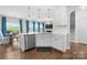 Bright open kitchen features a large island, stainless appliances, and modern lighting at 3619 Slider Ter, Lancaster, SC 29720