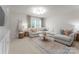 Bright living room with large sectional, decorative pillows, and a stylish coffee table at 3619 Slider Ter, Lancaster, SC 29720
