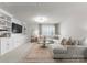 Spacious living room with a large sectional sofa, built-in shelves, and a cozy rug at 3619 Slider Ter, Lancaster, SC 29720