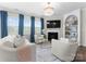 Bright living room with a fireplace, large windows, and modern furnishings perfect for entertaining guests at 3619 Slider Ter, Lancaster, SC 29720