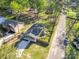 Aerial view of cozy home with fenced yard, surrounded by lush trees in a quiet neighborhood at 402 Digh St, Gastonia, NC 28052