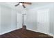 Bedroom with hardwood floors and doorways to the bathroom and the closet at 402 Digh St, Gastonia, NC 28052