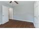 Bedroom featuring hardwood floors and a closet with a view to the adjacent rooms at 402 Digh St, Gastonia, NC 28052