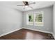 Sun-filled bedroom features hardwood flooring, neutral walls, and bright double windows at 402 Digh St, Gastonia, NC 28052