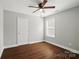 Bedroom with hardwood floors, a ceiling fan, window, and neutral paint at 402 Digh St, Gastonia, NC 28052