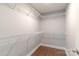 Walk-in closet features metal shelving and hardwood floors at 402 Digh St, Gastonia, NC 28052