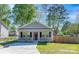 Charming single-story home featuring a well-manicured lawn and inviting covered porch area at 402 Digh St, Gastonia, NC 28052