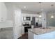Bright kitchen featuring granite countertops, modern stainless steel appliances, and ample white cabinetry at 402 Digh St, Gastonia, NC 28052