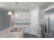 Bright kitchen featuring granite countertops, modern stainless steel appliances, and ample white cabinetry at 402 Digh St, Gastonia, NC 28052