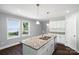 Bright kitchen featuring granite countertops, stainless steel appliances, and a view to the backyard at 402 Digh St, Gastonia, NC 28052
