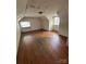 Bedroom with hardwood flooring, two windows, and unique ceiling angles at 404 S Mulberry St, Cherryville, NC 28021