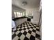 Vintage kitchen with black and white checkered floors, ready for renovation at 404 S Mulberry St, Cherryville, NC 28021
