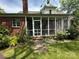 Enclosed back porch that gives the home space for outdoor relaxation at 404 S Mulberry St, Cherryville, NC 28021