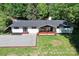 An aerial view showing the home's layout, updated roof, and surrounding landscape at 4110 Charles Raper Jonas Hwy, Alexis, NC 28006