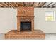 A brick fireplace in the unfinished basement offers a focal point with a classic design at 4110 Charles Raper Jonas Hwy, Alexis, NC 28006