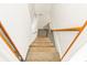 Carpeted basement stairs with wooden handrail at 4110 Charles Raper Jonas Hwy, Alexis, NC 28006