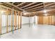 Spacious unfinished basement with support beams and painted floor ready for customization and storage at 4110 Charles Raper Jonas Hwy, Alexis, NC 28006