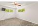 Light bedroom with neutral carpet and view of backyard at 4110 Charles Raper Jonas Hwy, Alexis, NC 28006