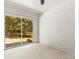 Bright bedroom with sliding door to the yard at 4110 Charles Raper Jonas Hwy, Alexis, NC 28006