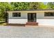 Close-up of the home's brick exterior with black trim and french doors at 4110 Charles Raper Jonas Hwy, Alexis, NC 28006