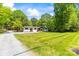 Well-maintained home with a manicured lawn and mature trees at 4110 Charles Raper Jonas Hwy, Alexis, NC 28006