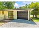 View of a one-story house with an attached garage, gravel driveway and fenced yard at 4110 Charles Raper Jonas Hwy, Alexis, NC 28006