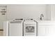 Laundry area with modern washer and dryer and sink at 4110 Charles Raper Jonas Hwy, Alexis, NC 28006