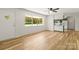 Open-concept living area with view of the kitchen and large window at 4110 Charles Raper Jonas Hwy, Alexis, NC 28006