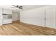Bright living room with sleek wood flooring and modern ceiling fan at 4110 Charles Raper Jonas Hwy, Alexis, NC 28006