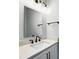 Modern bathroom with a vanity, large mirror, and sleek black fixtures at 424 Fulton Dr, Kings Mountain, NC 28086