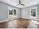 Bright, airy bedroom with lots of natural light from large windows and wood-look flooring at 424 Fulton Dr, Kings Mountain, NC 28086