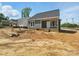 New home's exterior with classic siding, a gray roof, and a covered front porch at 424 Fulton Dr, Kings Mountain, NC 28086