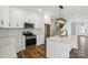 Well-lit kitchen with an island, stainless steel appliances, and hardwood flooring at 424 Fulton Dr, Kings Mountain, NC 28086